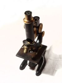 A 1915 Bausch and Lomb Optical microscope.