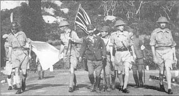 Lieutenant-General Arthur Percival, led by a Japanese officer, marches under a flag of truce to negotiate the capitulation of Allied forces in Singapore, on 15 February 1942. It was the largest surrender of British-led forces in history.