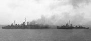 American destroyers rescuing crew from HMAS Canberra after the Battle of Savo Island