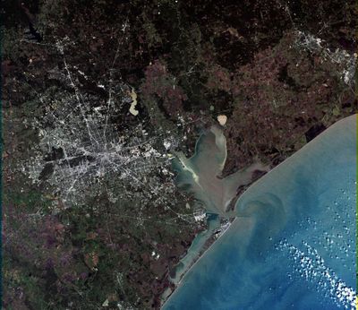 A simulated-color image of Houston taken on NASA's Landsat 7 satellite with Galveston Bay and Galveston Island visible in the picture