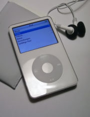 A white fifth generation iPod with a sleeve and earphones.