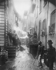 Bandit's Roost by Jacob Riis, 1888, from How the Other Half Lives. This image is Bandit's Roost at 59½ Mulberry Street, considered the most crime-ridden, dangerous part of New York City.