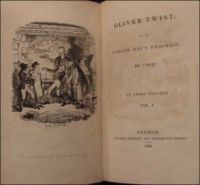Cover page of Oliver Twist, this the first novelization which appeared in 1838, six months before the serialization was completed. Dickens name appears as "Boz", although at Dickens request it was changed to his real name a week after this initial version appeared. Art by George Cruikshank titled "Oliver's reception by Fagin and the boys." Source: The New York Public Library, Berg Collection of English and American Literature.
