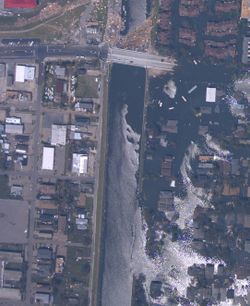 Breach in 17th Street Canal levee in New Orleans, Louisiana, on August 31, 2005. (NOAA)