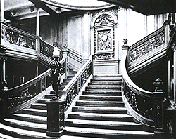 Titanic's grand staircase. Considered to be the most lavish part of the ship, the staircase allowed natural light to seep through the glass dome.  It had elaborate wood panelling and a bronze cherub lamp support that only added to the 1st Class passengers' luxurious surroundings