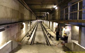 View of a track from a sandpile bumper-post showing the cross-section of guide ways, concrete rollways and conventional track