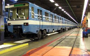 An older generation MR-63 train is in the Beaugrand Garage. Note the turntable to change trucks in the foreground.