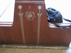 The Pennsylvania Railroad, as the "standard railroad of the world", also strove for an air of permanence, decorating its railroad stations with symbols of itself such as the Pennsylvania Herald, shown above at Newark Penn Station.