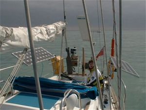 The solar panels on this small yacht at sea can charge the 12 volt batteries at up to 9 amperes in full, direct sunlight.