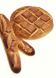 Sourdough breads like this baguette (left) and roundbread begin with a starter passed down from excess batter from a previous loaf.