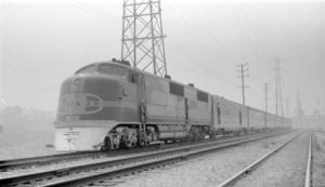 Train No. 71, the southbound San Diegan, inches its way through the morning fog in Los Angeles, California on August 1, 1940.