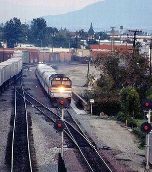 Amtrak Train No. 580 (powered by an EMD F40PH in "push" mode) departs the station in Fullerton, California with the southbound San Diegan in January, 1998.