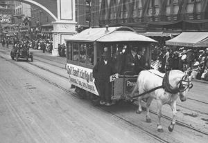 "Rapid Transit in San Diego": An original 1886 horse-drawn trolley and its driver participate in a parade celebrating the groundbreaking of the Panama-California Exposition Center in 1911.