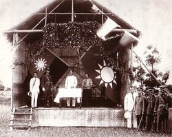 Sun Yat-sen [middle] and Chiang Kai-shek [on stage in uniform] at the founding of the Whampoa Military Academy in 1924.