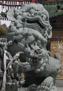 Large Snow Lions guard the entrance to the Potala Palace