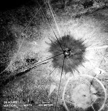 An aerial shot of the "Trinity" crater shortly after the test. The small crater in the southeast corner was from the earlier test explosion of 100 tons of TNT.