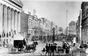 View in Wall Street from Corner of Broadway, 1867. The building on the left was the U.S. Customs House at the time but is today the Federal Hall National Memorial.