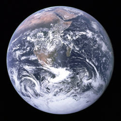 Over two thirds of the earth's surface is covered with water, 97.2% of which is contained in the five oceans. The Antarctic ice sheet, containing 90% of all fresh water on the planet, is visible at the bottom. Atmospheric water vapour can be seen as clouds, contributing to the earth's albedo.