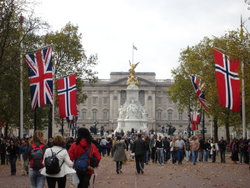 A new ceremonial approach to Buckingham Palace, was designed by Sir Aston Webb and completed in 1911 as part of a grand memorial to Queen Victoria. Beginning at Admiralty Arch progressing along The Mall it culminated in a vast statue of Victoria sculpted by Sir Thomas Brock in front of Webb's newly refaced Buckingham Palace.