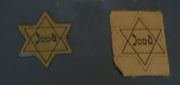 Yellow stars of the type that all Jews were required to wear during the Nazi occupation.