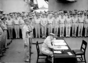 The signing of the Japanese surrender MacArthur (sitting), behind him are Generals Percival and Wainwright