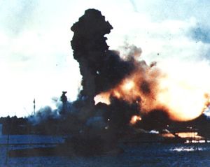 The forward magazines of the USS Arizona exploded after it was hit by a bomb dropped by Tadashi Kusumi.