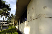 Damage to the headquarters building at Hickam Air Force Base, still visible.