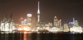 Auckland CBD at night, with the 'Captain Cook Wharf' part of the port in the foreground.