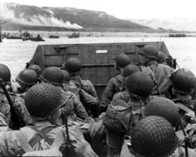 Troops in an LCVP landing craft approach Omaha Beach June 6, 1944.