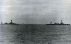 USS Louisville (right) tows crippled USS Chicago on the morning of January 30, 1943.