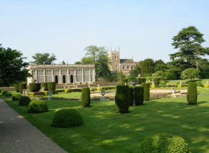 The "Italian garden", Orangery and Church. The Orangery and "Italian garden" were designed by Jeffry Wyatville in the early 19th century. The church contains the tombs of the Browlow and Cust owners of Belton House.