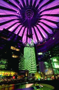 Berlin's Sony Center in Potsdamer Platz reflects the global reach of a Japanese corporation.  Much cyberpunk action occurs in urbanized, artificial landscapes, and "city lights at night" was one of the genre's first metaphors for cyberspace (in Gibson's Neuromancer).