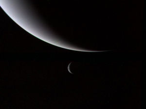 Photograph of the planet Neptune and its moon Triton, taken by Voyager 2 as it entered the outer solar system.