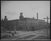 A photograph of the Cadillac Motor Car Company Main Plant on Cass Avenue at Amsterdam Street in Detroit, circa 1910.