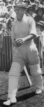 Bradman walking out to bat in the third Test against England at the Melbourne Cricket Ground. His innings of 270 won the match for Australia.