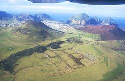 Helgafell (left) and Eldfell (right) today. The line of the 1973 fissure south of Eldfell is clearly seen