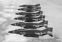 The Blue Angels fly their F-4J Phantoms cross-country between show sites in a line abreast formation.