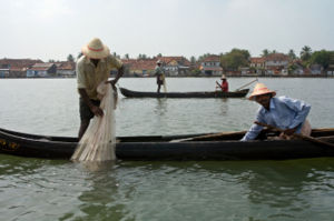 Fishermen in the harbor of Kochi, India.