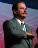 President Vicente Fox performing the civil salute
