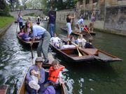 Punting on the Cam river is a popular recreation in Cambridge.