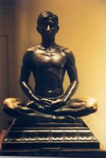 Sculpture of a man  meditating.