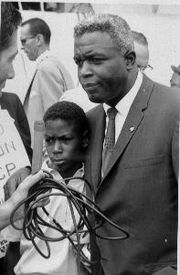 Jackie Robinson and his son David being interviewed at the "March on Washington"August 28, 1963From the National Archives