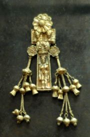 Pendant with naked woman. Electrum, Rhodes, ca. 630-620 BCE
