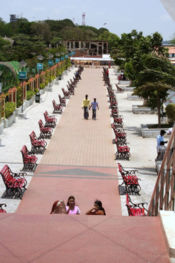 Pedestrians stroll along the Royal Musical Walkway of Kochi's Marine Drive.