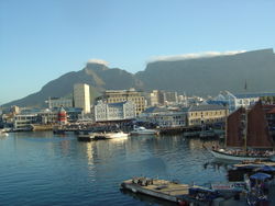 The Victoria & Alfred Waterfront in Cape Town with Table Mountain in the background. Cape Town has become an important retail and tourism centre for the country, and attracts the largest number of foreign visitors in South Africa.