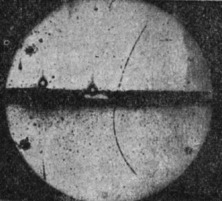 A new particle is discovered: The first detection of the positron occurred in 1932 in a cloud chamber built by Carl D. Anderson.  The track of the positron can be seen, going from top to bottom and curving to the right.