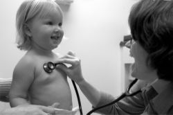 Physician examining a child