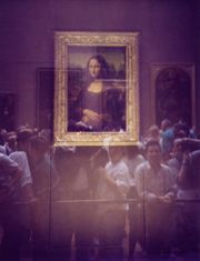 Museum visitors viewing the Mona Lisa through security glass (prior to 2005 move)