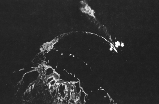 U.S. B-17s bomb the damaged Japanese battleship Hiei (upper right) from high altitude north of Savo Island on November 13, 1942.  Hiei appears to be trailing oil.