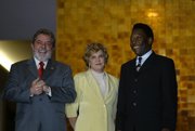 Pelé, right, with Brazil President Luiz Inácio Lula da Silva, left, and Dona Marisa, July 13, 2004.